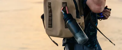 Shows the product being carried during an outdoor adventure to help shoppers envision portability and active lifestyle use.
