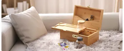 Places the wooden box in a cozy home setting so shoppers can picture it on their own sofa or table.