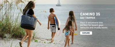 Shows the product in a real-world beach setting to help shoppers envision using the bag for outdoor and beach activities.
