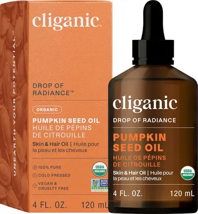 Showcases the product packaging and bottle to highlight the organic, cold-pressed, vegan and cruelty-free nature of the pumpkin seed oil.