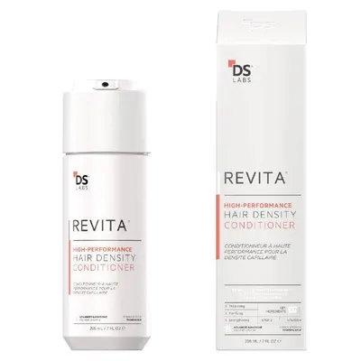 Shows the product packaging and bottle to communicate the brand identity and contents of the hair conditioner.