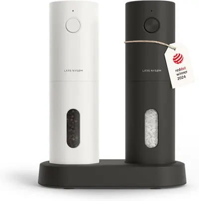 Showcases the sleek, modern design of the salt and pepper grinders and highlights the available color choices. Displays the product in two color options and emphasizes its award-winning status with…