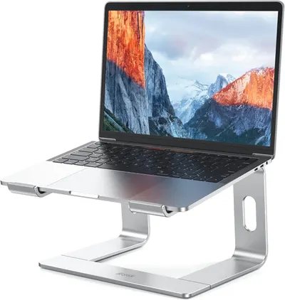 Showcases the sleek design and ergonomic benefits of the laptop stand, emphasizing its ability to elevate and angle the laptop for improved comfort and…