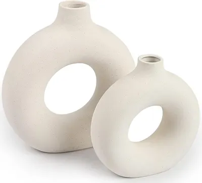 Showcases the distinctive donut-shaped ceramic vases to highlight their modern, artistic design.