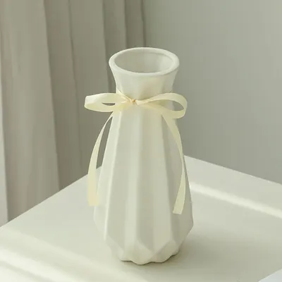 Showcases the vase as a stylish and sophisticated home decor item, emphasizing its aesthetic appeal in a real-world setting.