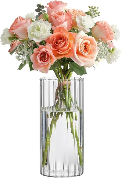 Showcases the beauty and composition of the flower bouquet in a clear glass vase.