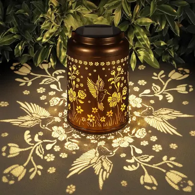Showcases the product's ability to create a warm, enchanting atmosphere with its intricate light projection patterns.