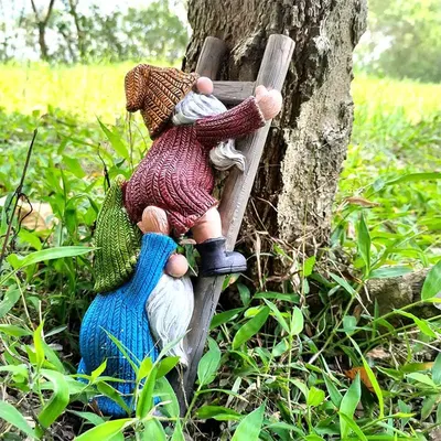 Showcases the product in a natural outdoor setting to demonstrate its use as garden decor and appeal to customers interested in unique, playful outdoor accessories.