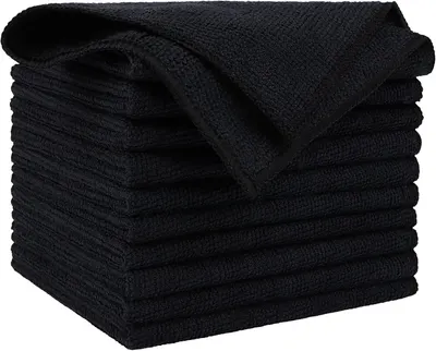 Showcases a stack of black microfiber towels to highlight the product's appearance and quantity.