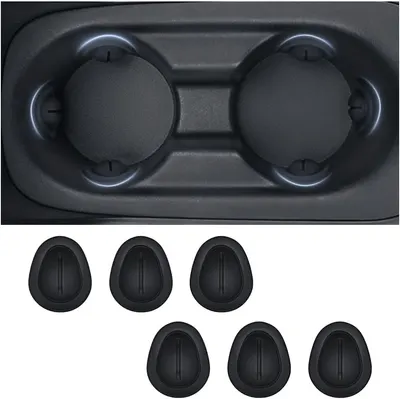 Showcases the product's design and fit within a vehicle cup holder, demonstrating its compatibility and functionality.