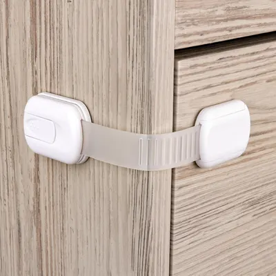 Demonstrates the functionality of a cabinet child safety lock to reassure parents about home safety.