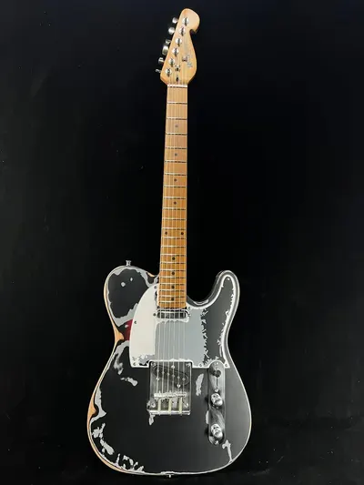 Showcases the distinctive aesthetic and premium build of the electric guitar to appeal to musicians and collectors.