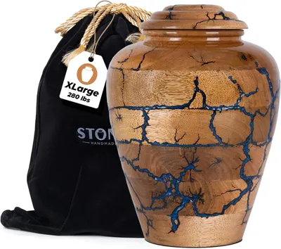 Showcases the unique design and craftsmanship of the wooden urn with blue inlay pattern. Demonstrates the included protective storage bag and size label for the product.