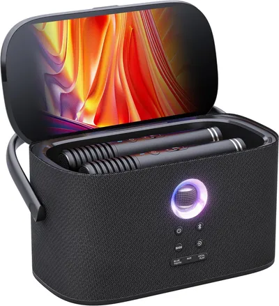 Shows the buyer exactly what is included in the purchase: the speaker case with two wireless microphones stored inside, demonstrating the complete karaoke system package.
