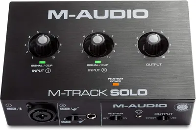 Displays the M-Audio M-Track Solo audio interface clearly on a white background to show the product design, control layout, and branding for easy identification in search results.