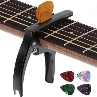 Shows the guitar capo along with all included items such as the wooden pick holder and four colorful guitar picks to demonstrate the complete value of the purchase.