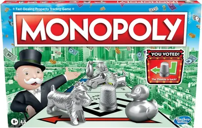 Shows the retail packaging of the Monopoly board game to help shoppers identify the product on shelf or confirm what they will receive in their delivery. Displays the iconic Monopoly game pieces…