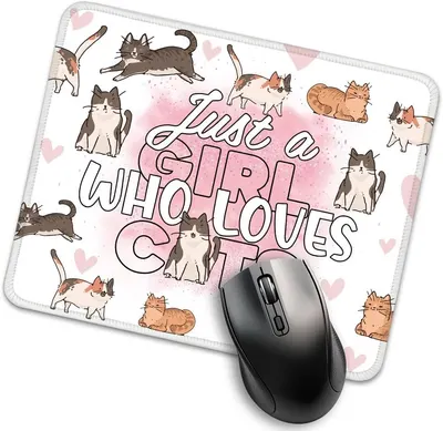 Shows the core product—a mouse pad with a cat-themed design—clearly displayed with a computer mouse to demonstrate its intended use and scale. Highlights the decorative design elements printed on…