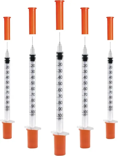 Displays five identical syringes with orange caps and plungers to show the product clearly and communicate that this is a multi-pack purchase.