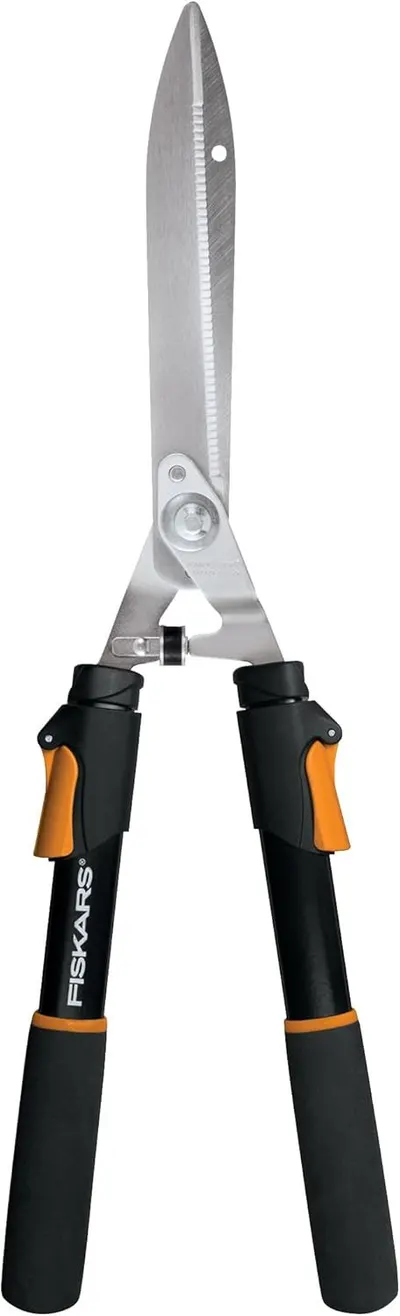 Displays the core product clearly on a white background to show the hedge shears' design, serrated cutting blade, and comfortable grip handles with Fiskars branding.