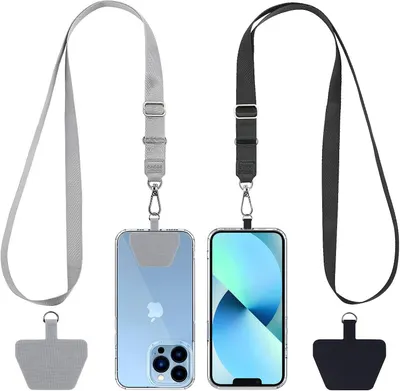 Shows the core product clearly - phone lanyard straps with attachment clips in two color variants (gray and black), demonstrating how they attach to phones and their adjustable design. Displays two…