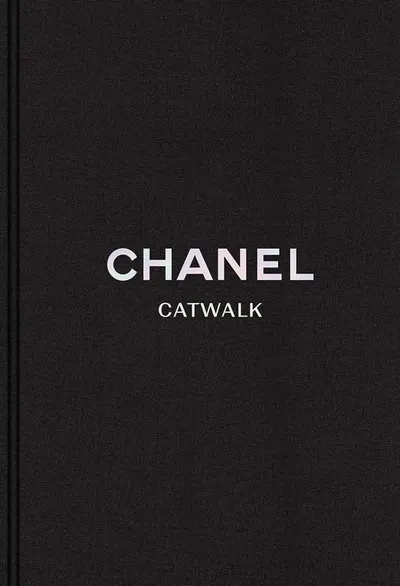 Displays the core product, a Chanel Catwalk book, with clean minimalist presentation to communicate luxury and brand prestige.