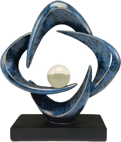 Displays the core decorative sculpture product with its distinctive blue ceramic finish, gold accents, and central sphere to communicate its artistic design and premium quality as a home decor piece.