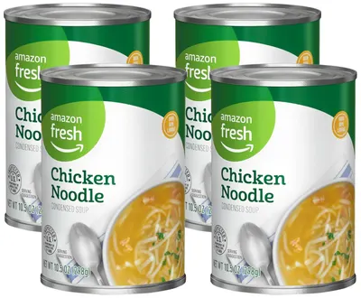 Shows the core sellable product, a 4-pack of Amazon Fresh Chicken Noodle Condensed Soup cans, clearly displaying the brand, product name, and packaging to help shoppers identify what they are…