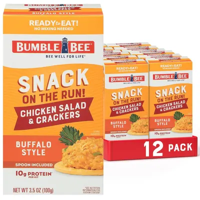 Shows the core product—a 12-pack of Bumble Bee chicken salad snack kits—clearly displayed with individual packaging visible to communicate the multi-pack format and convenience. Displays the retail…