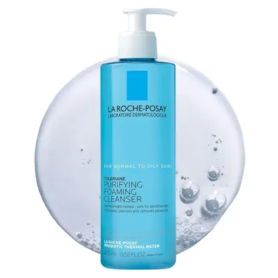 Displays the La Roche-Posay cleanser bottle clearly to show the product packaging, branding, and key product claims for normal to oily skin. Uses decorative water bubbles and a circular background…