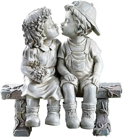 Displays the core product, a decorative statue of two children sitting on a bench, clearly showing the detailed craftsmanship and design to help shoppers visualize it as a garden or home decor piece.
