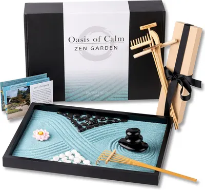 Displays the complete zen garden set with all included components—sand tray, stones, rake, wooden accessories, and decorative elements—to show shoppers exactly what they will receive and communicate…