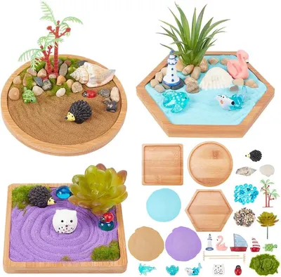 Shows the complete miniature zen garden kit with three assembled examples and all included components to demonstrate the variety and creative possibilities of the product. Displays all the included…