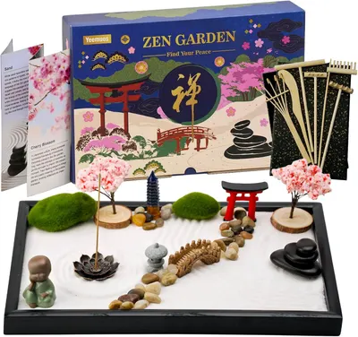 Shows the complete Zen Garden kit with all included components - miniature trees, stones, rake, sand tray, torii gate, pagoda, and decorative elements - to communicate the full value and contents of…