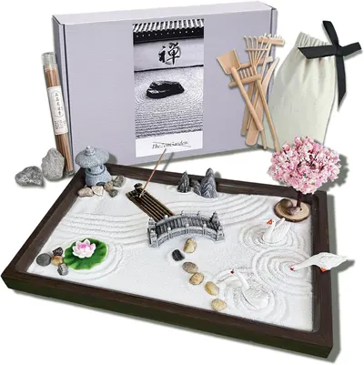 Shows the complete zen garden kit with all included components displayed together, allowing shoppers to see exactly what they will receive and understand the full value of the set. Demonstrates the…