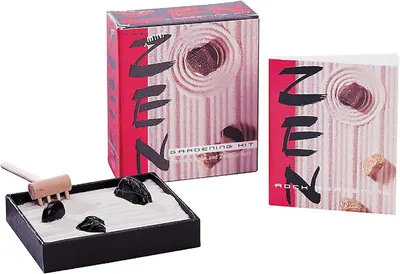 Shows the complete zen gardening kit with all included components (sand tray, rake, decorative rocks) to communicate what the buyer receives and how the product looks assembled. Displays the retail…