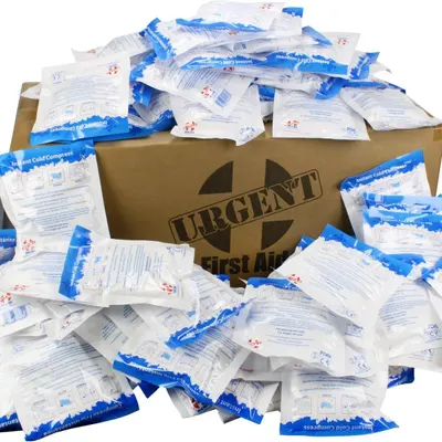 Shows the large quantity of instant cold compress packs included in the purchase, emphasizing value and preparedness for first aid needs. Displays the URGENT First Aid branded shipping box to…