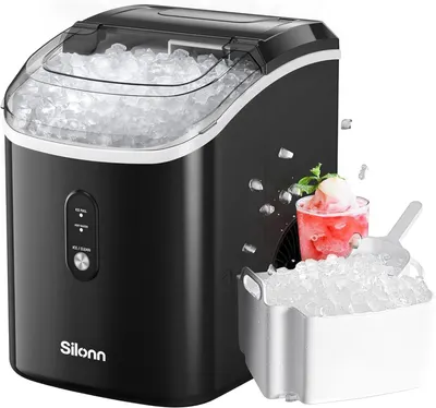 Shows the core ice maker product actively producing ice with a clear view of the ice storage basket and ice scoop, demonstrating what the product looks like and what it does. Uses floating ice cubes…