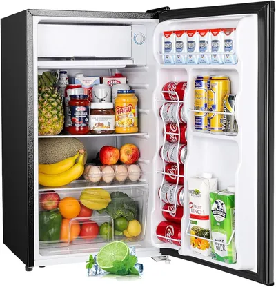 Shows the mini fridge fully stocked with food and beverages to demonstrate its storage capacity and practical use for dorms, offices, or small spaces. Demonstrates how the refrigerator functions in…