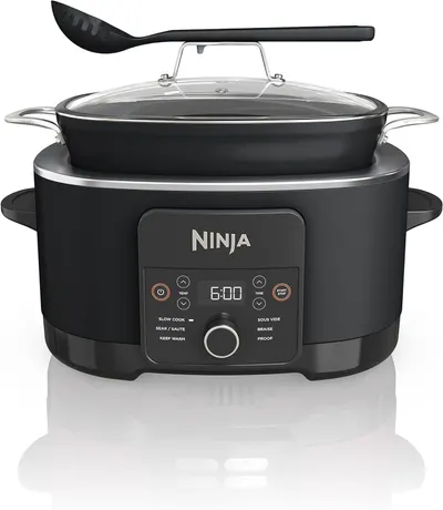 Displays the complete Ninja cooking system including the base unit, cooking pot with glass lid, and serving spoon to show shoppers everything included and the professional appearance of the product.…
