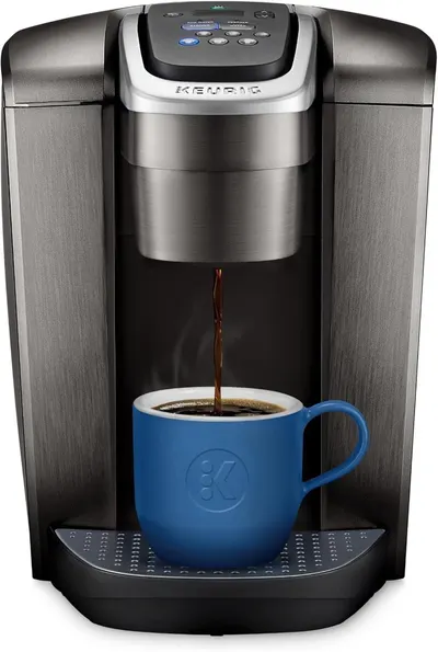 Shows the coffee maker actively dispensing coffee into a mug to demonstrate how the product works and what it does, reassuring shoppers about its brewing capability and ease of use. Displays the…