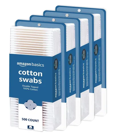 Shows the core product (Amazon Basics cotton swabs) in a 4-pack configuration, clearly displaying the packaging and product contents to help shoppers understand what they will receive. Displays the…