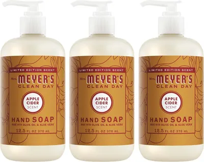 Shows three identical bottles of Mrs. Meyer's Apple Cider hand soap to communicate that this is a multi-pack purchase, emphasizing the limited edition seasonal scent and value of buying multiple…