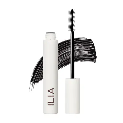 Shows the core mascara product with its brush applicator clearly visible, allowing shoppers to see both the tube and the brush design. Displays artistic mascara swatches in the background to…