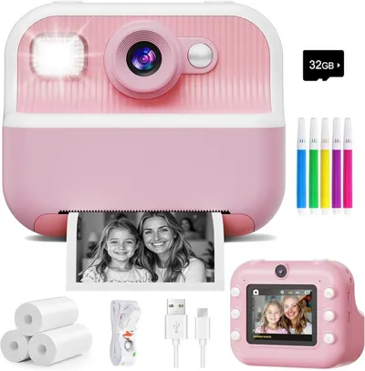 Shows the core product, a pink instant print camera for kids, along with all included accessories to communicate the complete package the buyer will receive. Displays all the included accessories…