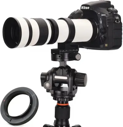 Displays the core product setup showing a Nikon D810 camera with a white telephoto lens mounted on a professional tripod head, communicating the complete photography system to potential buyers.…