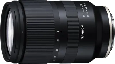 Displays the Tamron 17-70mm F/2.8 camera lens as the core sellable product in a clean, catalog-style presentation to show its design, build quality, and specifications.
