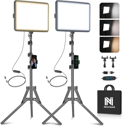 Shows the complete lighting kit with two LED panels on tripods, phone mounts, and accessories to communicate the full package the buyer will receive. Displays all included accessories and components…