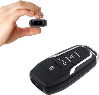 Shows the core product (a small camera disguised as a car key fob) and demonstrates its ultra-compact size by showing it held between fingers, reassuring shoppers that it is portable and discreet.…
