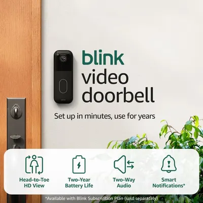 Shows the Blink video doorbell installed on an actual door in a home environment to help shoppers visualize how the product will look and fit in their own space. Communicates key product features…